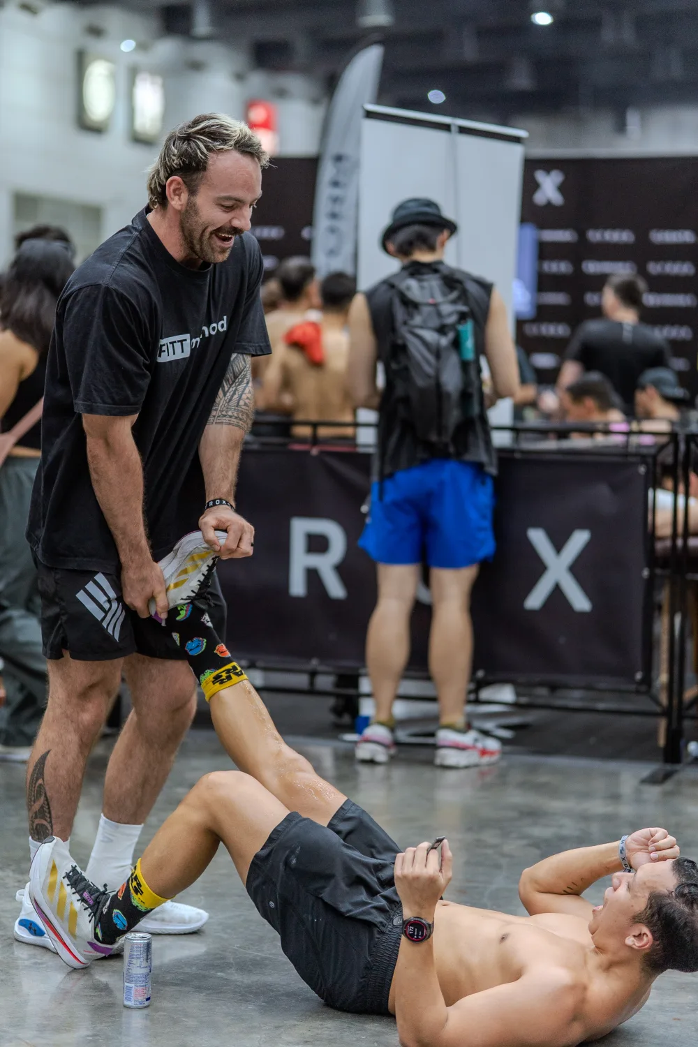 Coach motivating an athlete at HYROX Bangkok