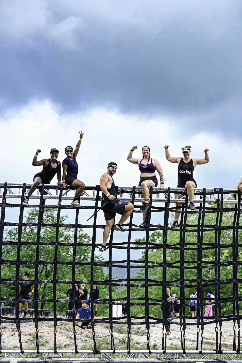 Team conquering the rope climb